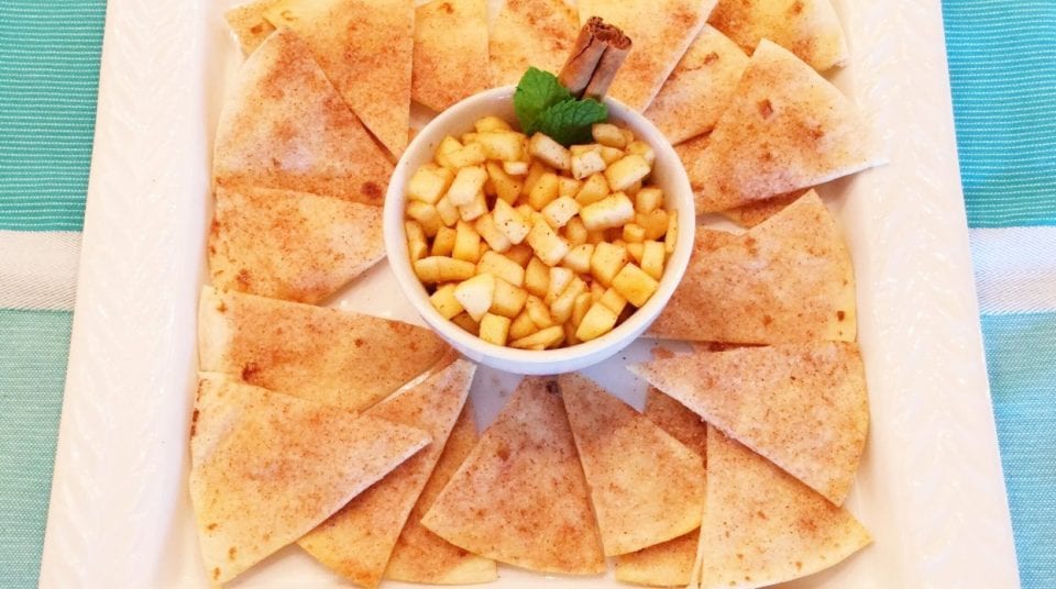 Cinnamon tortilla chips with apple dip on a plate.