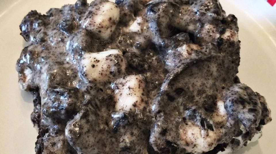Oreo and marshmallow dessert bar on a white plate.