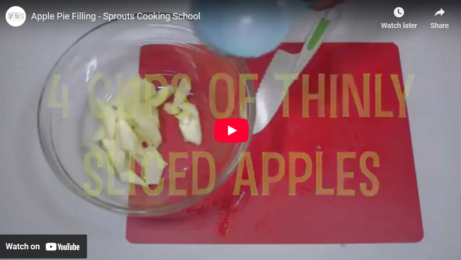 Glass bowl with sliced apples on red cutting board, text says '4 cups of thinly sliced apples'.